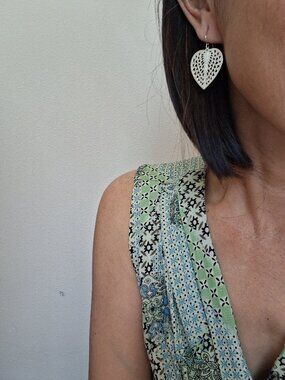 Delicate silver heart shaped dangle earrings